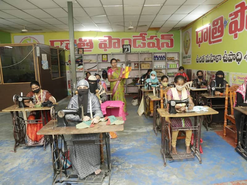 Women at sewing machines in a tailoring class