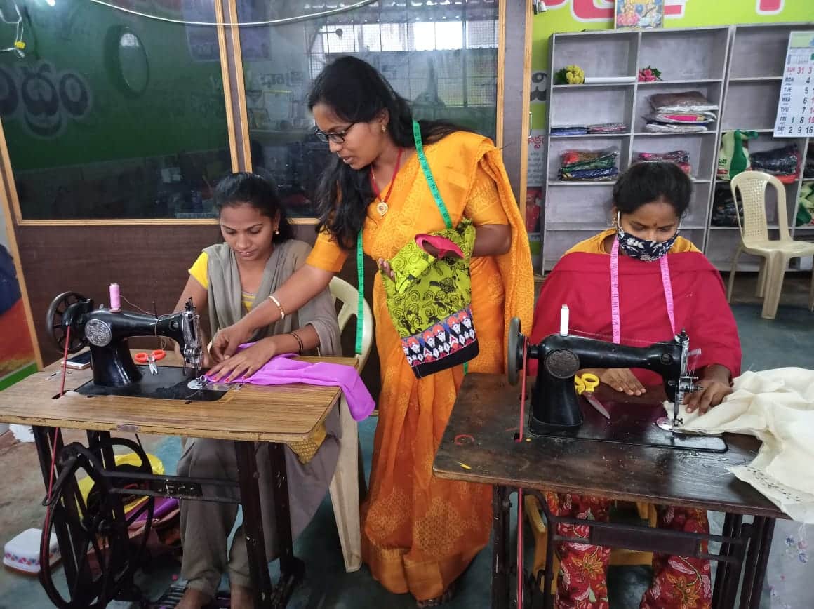 Women learning tailoring at a Dhaathree Foundation training centre
